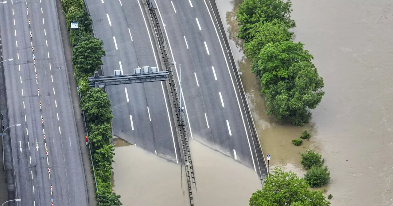 The German chancellor tours flooded regions in the southwest in a show of solidarity