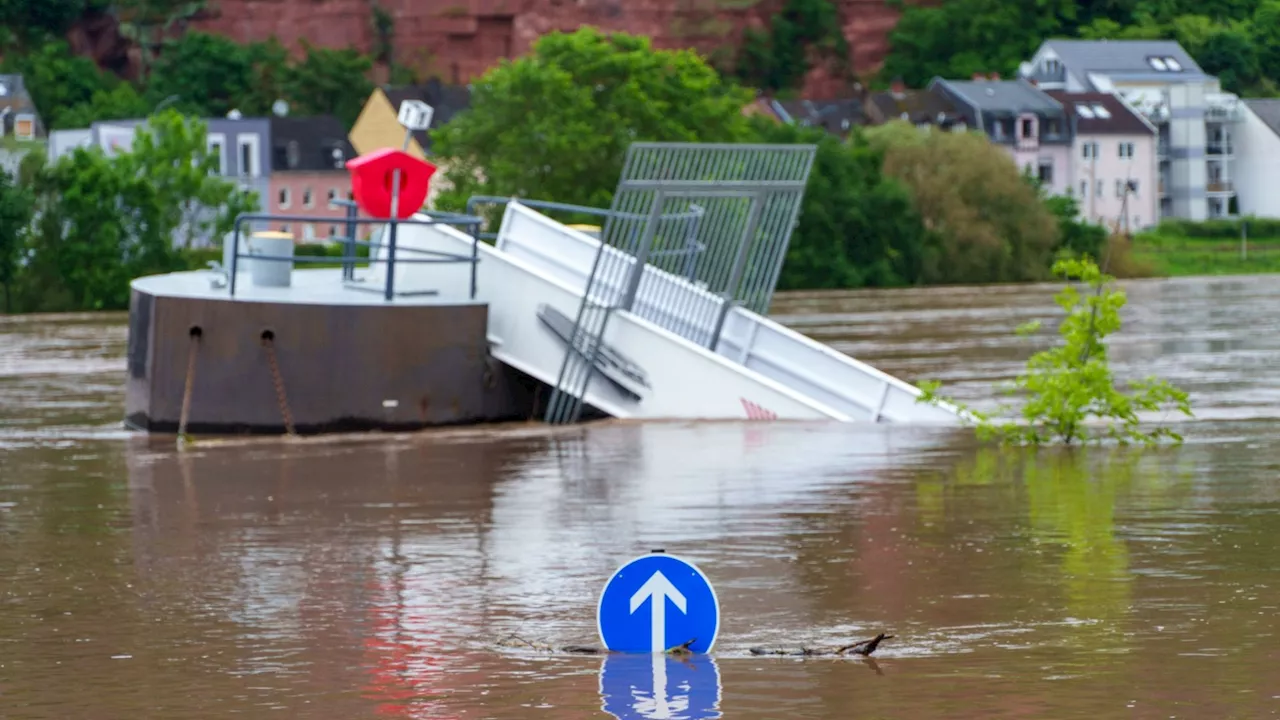 Devastating floods sweep German town turning roads into rivers as city sends out emergency alerts after...