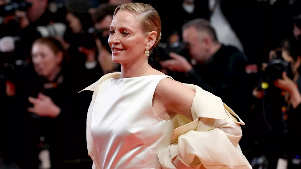 Uma Thurman al Festival di Cannes 2024 con abito e trench