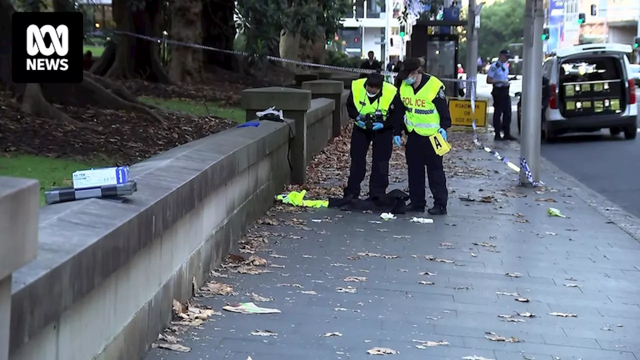 NSW Police charge man after officer was allegedly stabbed in the head in Sydney's CBD