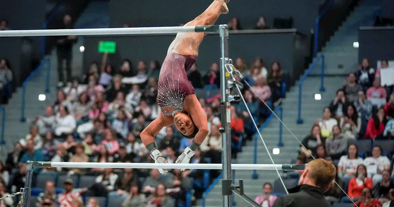 Gabby Douglas falters, Simone Biles shines at Olympic qualifying event