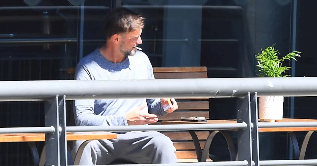 Klopp spotted having a smoke at Titanic Hotel ahead of final game