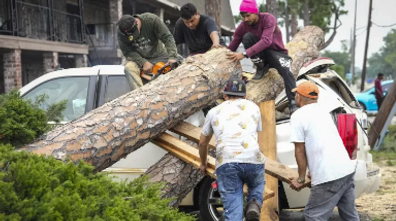 Houston storms kill seven, leave hundreds of thousands without power amid heat wave