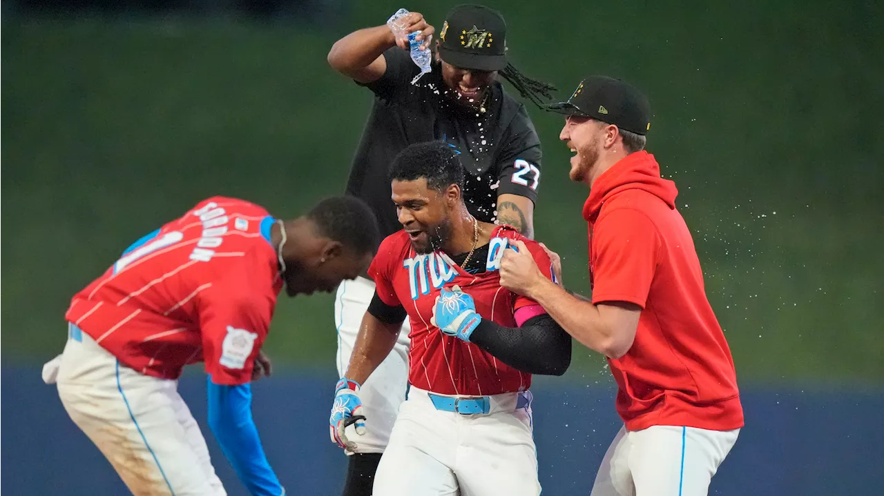 Marlins score four in ninth rally past Mets in 10th