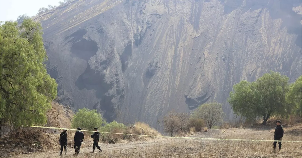 Searchers find a charred pit on Mexico City's outskirts that may be a clandestine crematorium