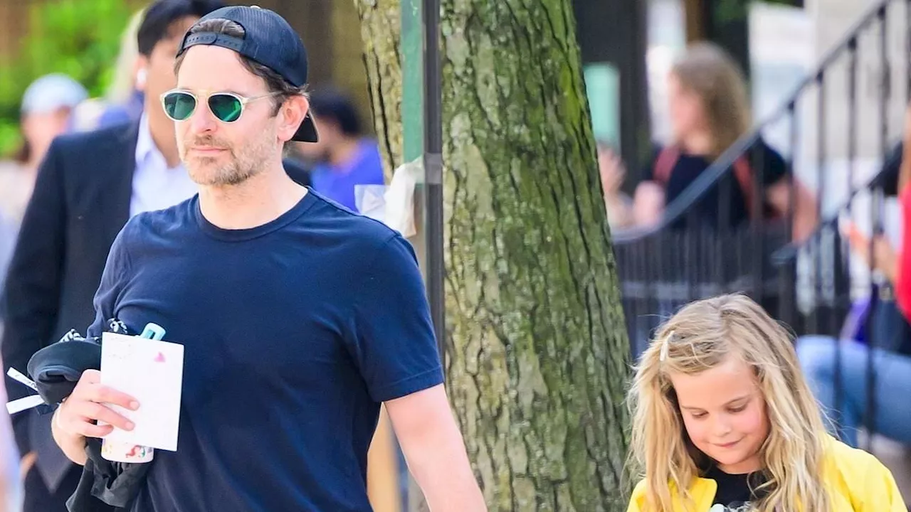 Bradley Cooper the doting dad holds hands with daughter Lea De Seine, seven