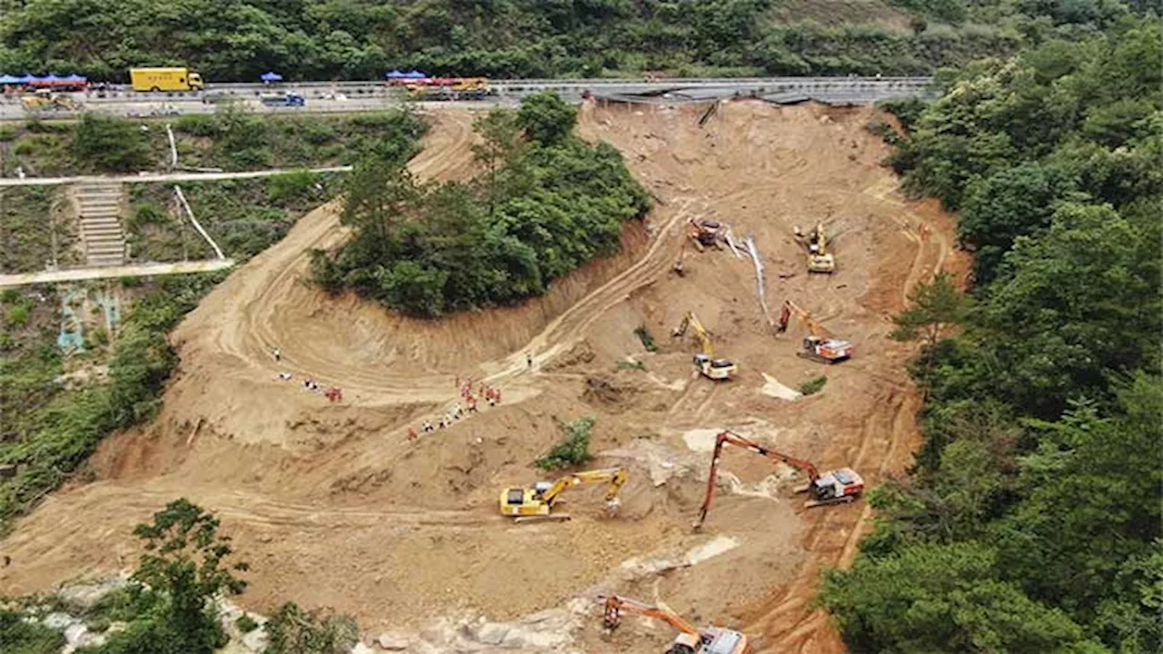 Death toll jumps to at least 48 as a search continues in southern China highway collapse