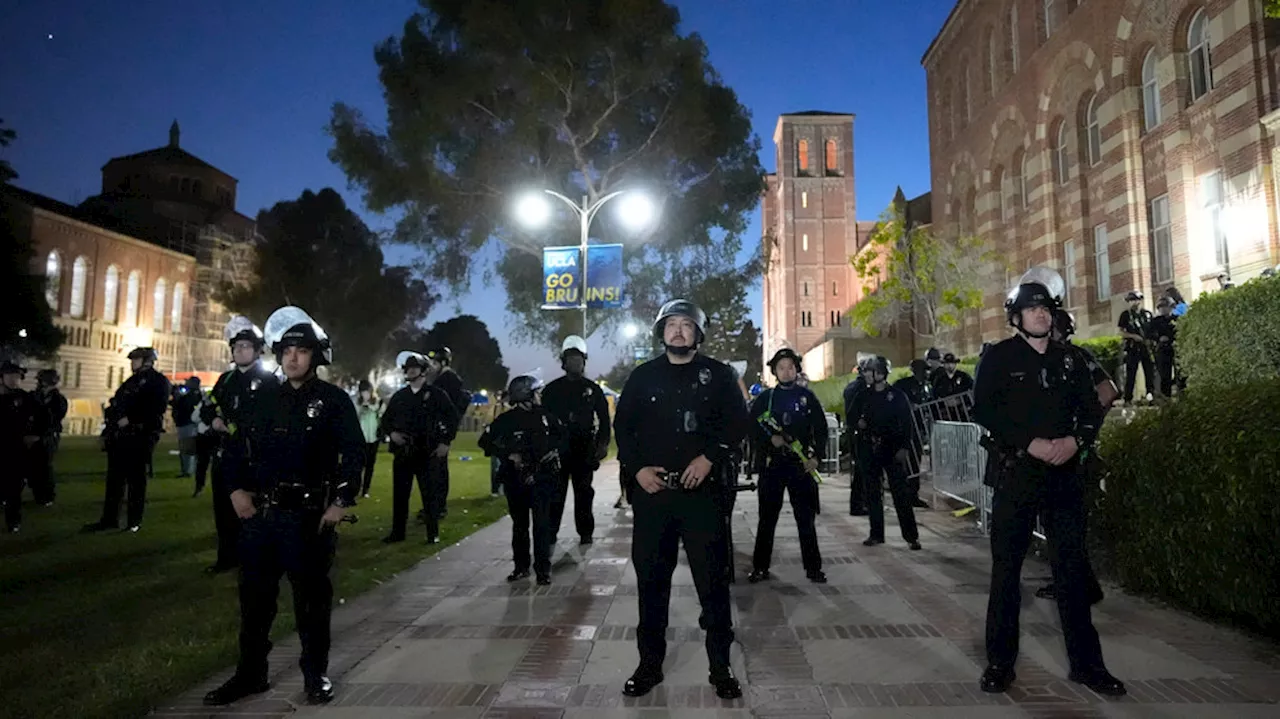 Police begin removing barricades at encampment at UCLA as protests continue on campuses