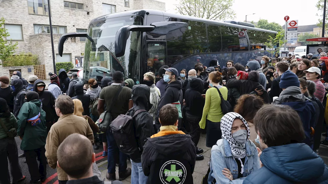 Protesters block and SLASH tyres of coach taking illegal migrants from London hotel to Bibby Stockholm...