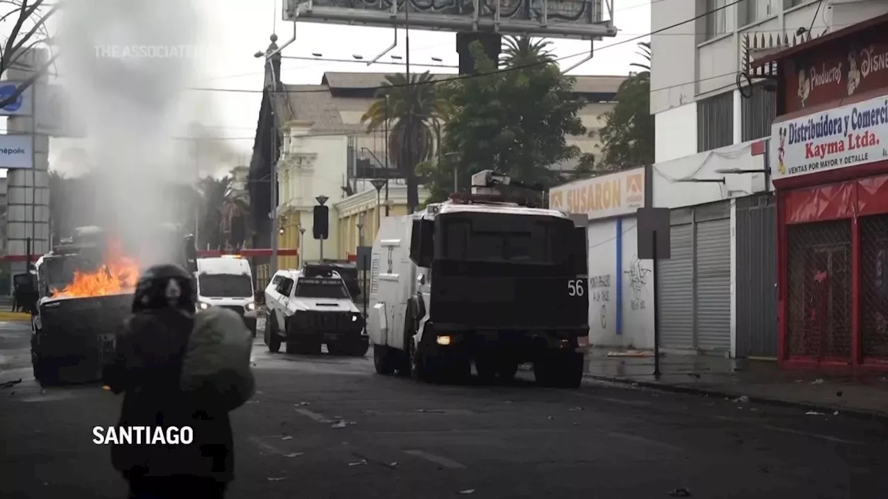 Chilean police use water cannons to disperse May Day march protesters