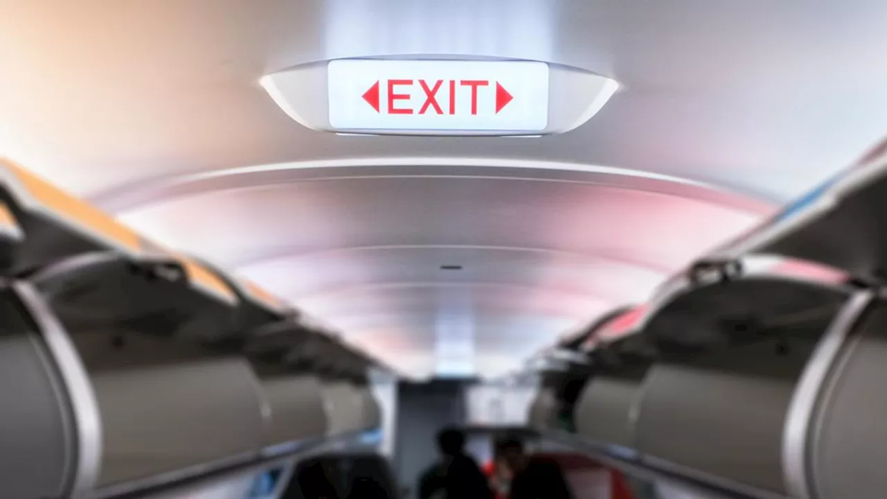 Man accused of trying to open plane emergency exit door mid-flight to Sydney Airport