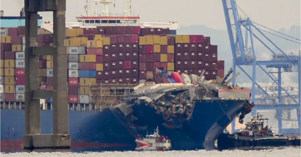 Battered cargo ship that brought down Baltimore bridge escorted to port