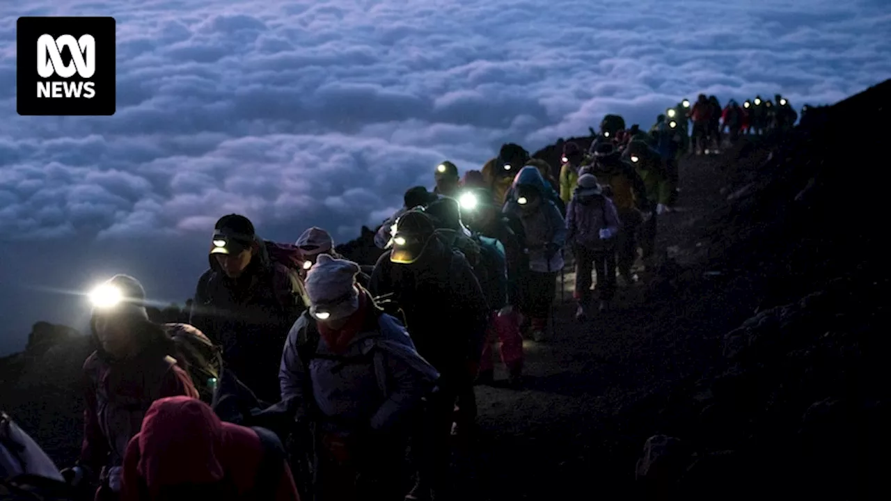 Tourists required to book to climb Mount Fuji as Japan struggles with over-tourism