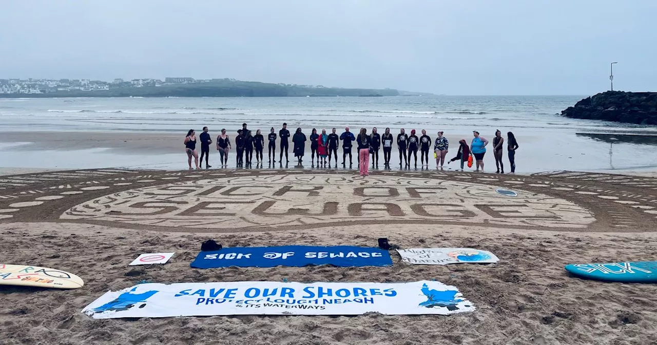 Surfers and swimmers paddle out in Portrush to demand action on pollution