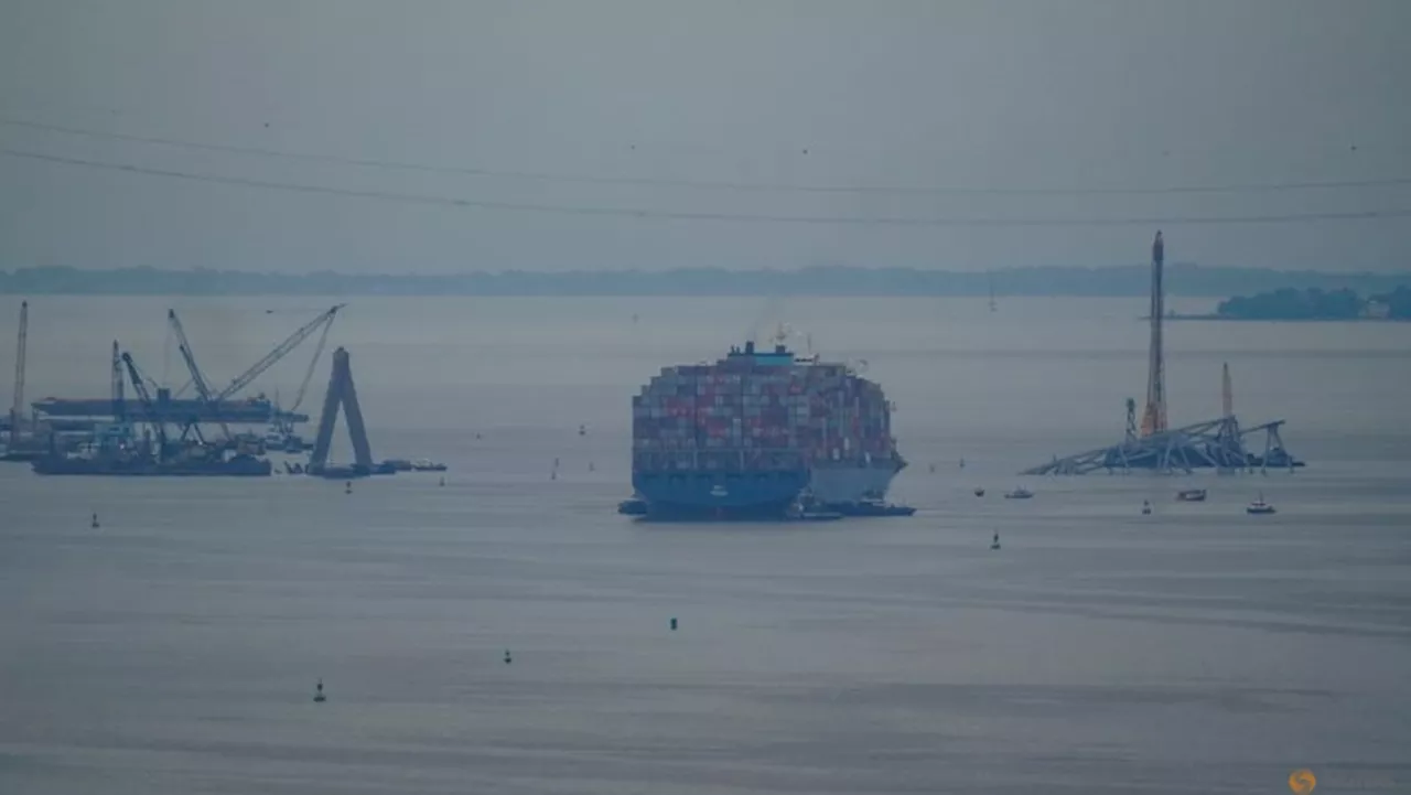 Crashed ship that took down Baltimore bridge refloated, towed from channel