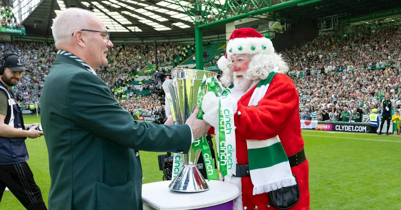 Rangers hero Ally McCoist reacts to Santa delivering Celtic league trophy