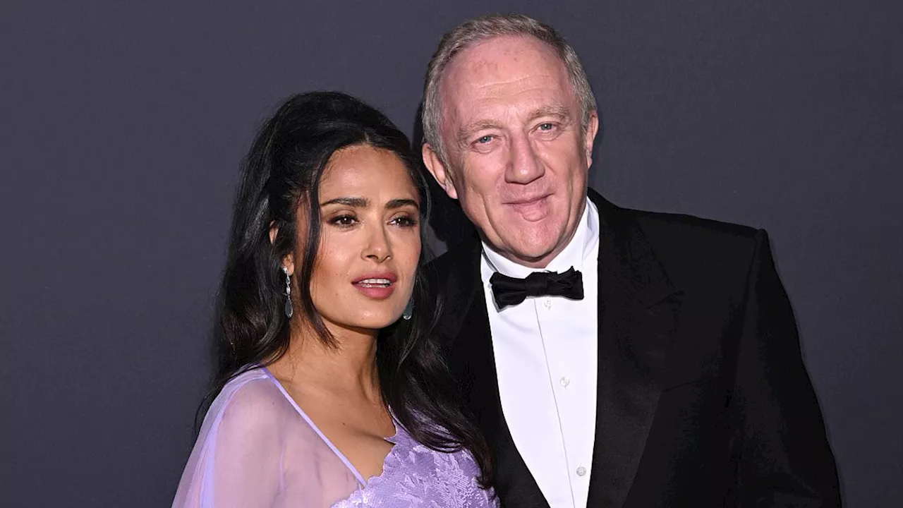 Salma Hayek wows in a caped lilac gown as she cosies up to husband François-Henri Pinault at Women...