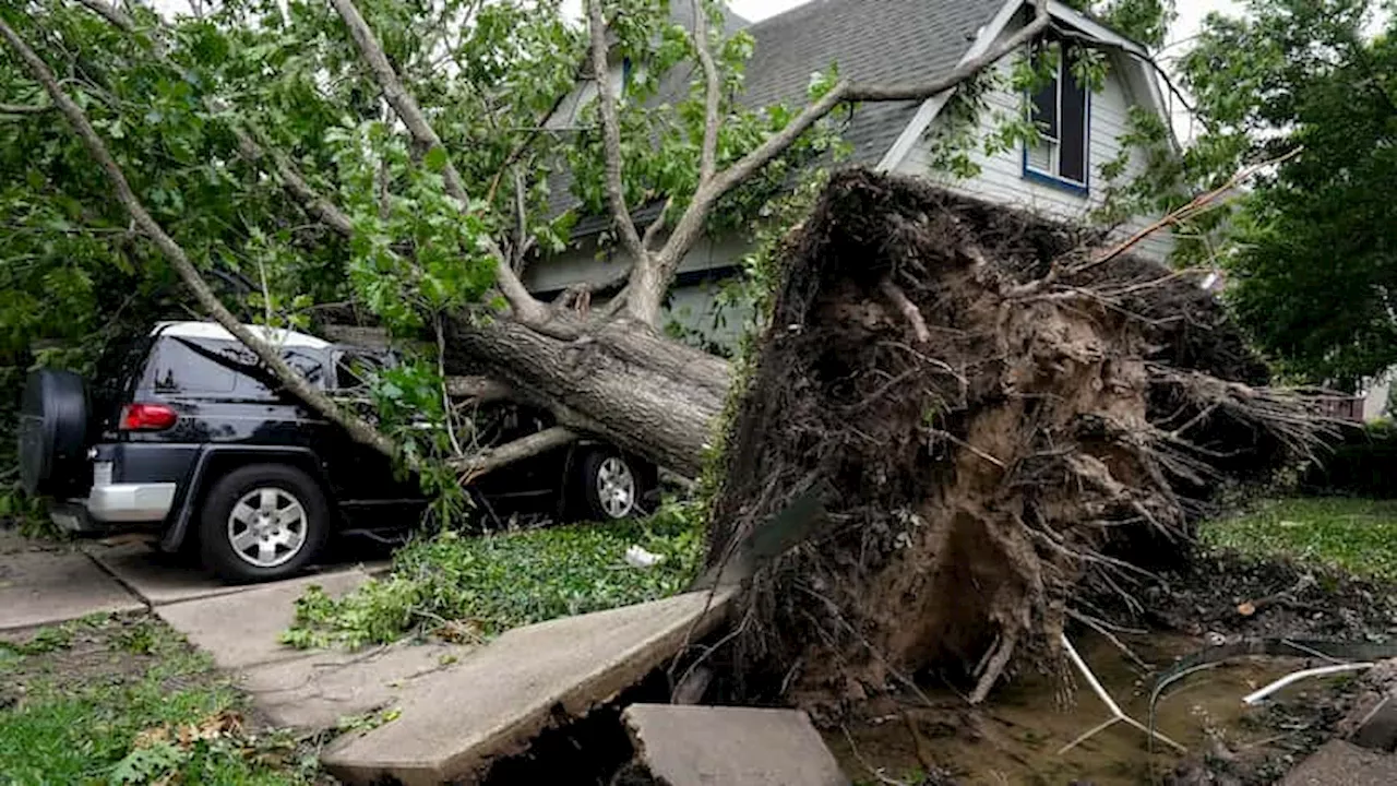 Photos: Houston cleans up, hundreds of thousands without power