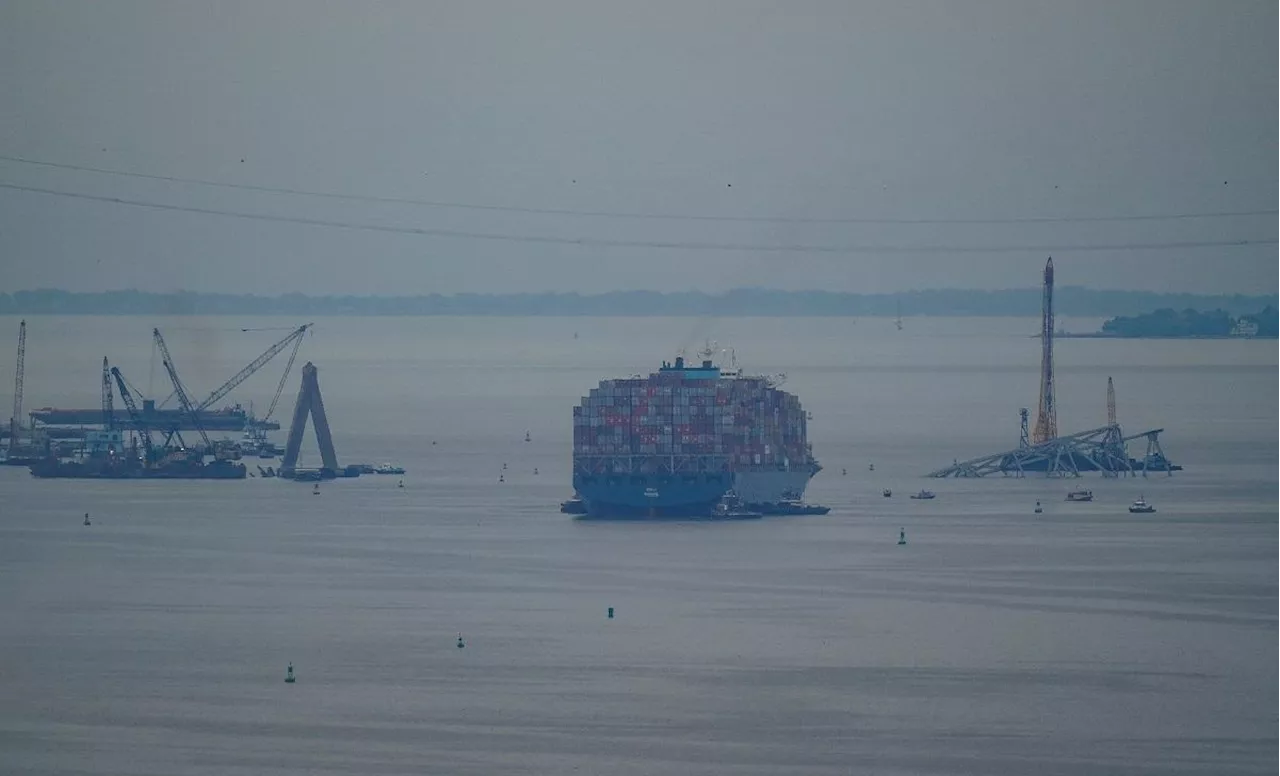 Crashed ship that took down Baltimore bridge refloated, towed from channel