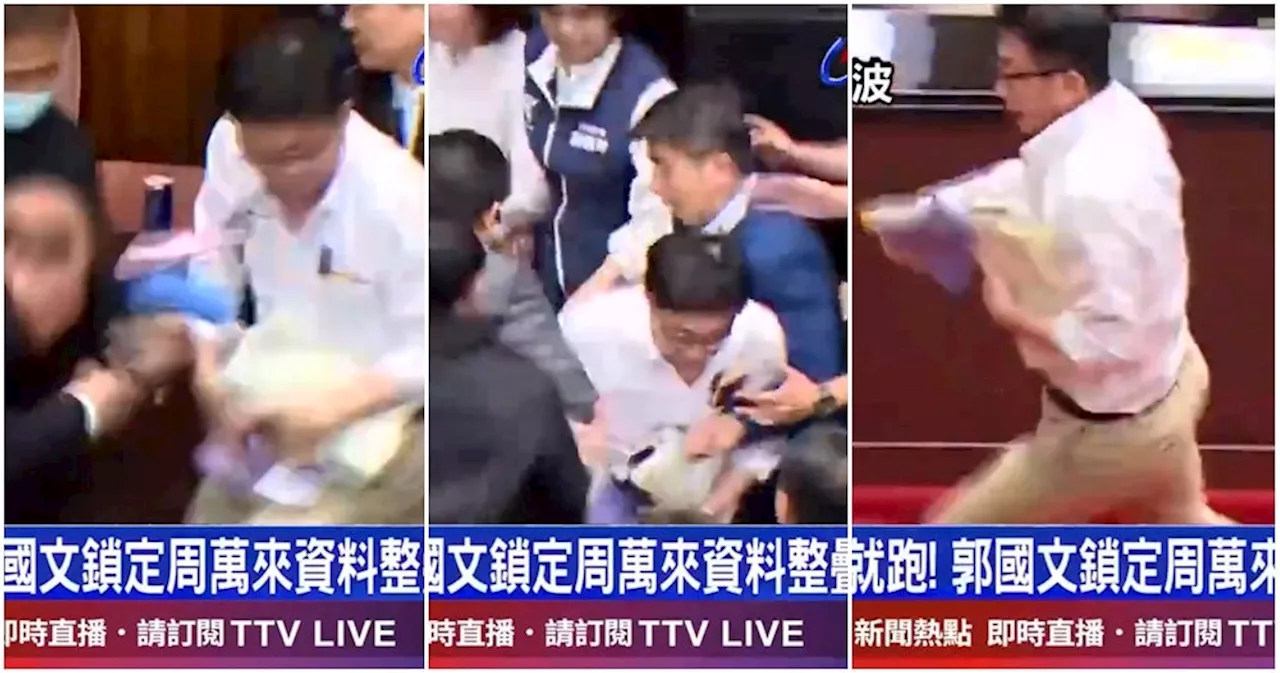 WATCH: Taiwanese Parliament Member Runs Away With Bill to Prevent it From Being Passed