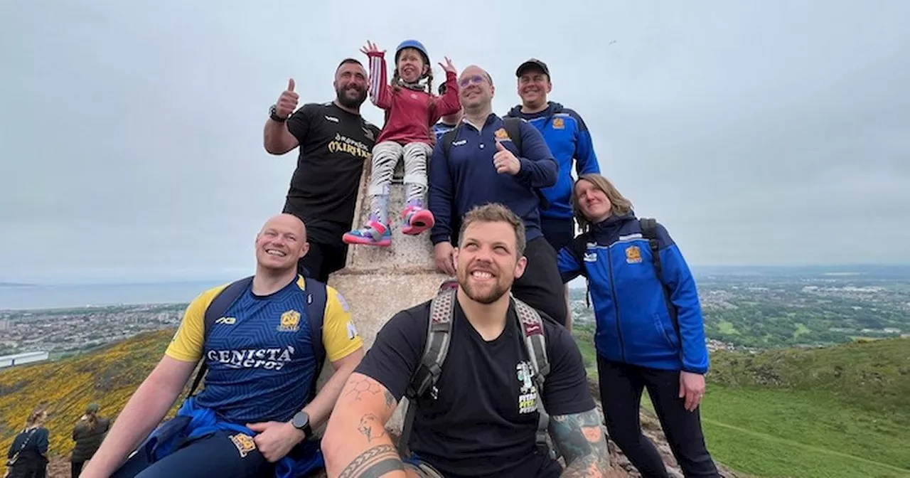 Disabled schoolgirl scales Arthur's Seat thanks to help from hero rugby players