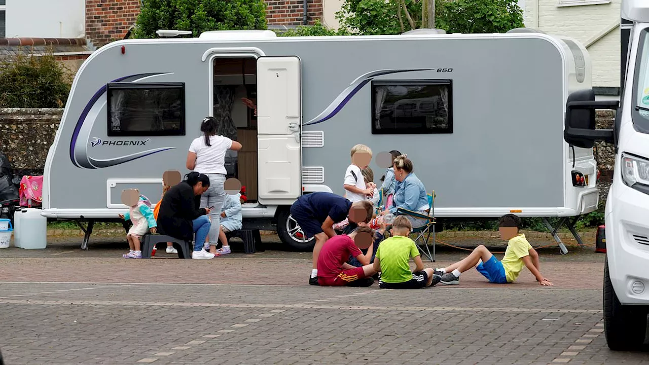 Dozens of caravans park up in historic Chichester after hundreds of Travellers descended on Wickham...