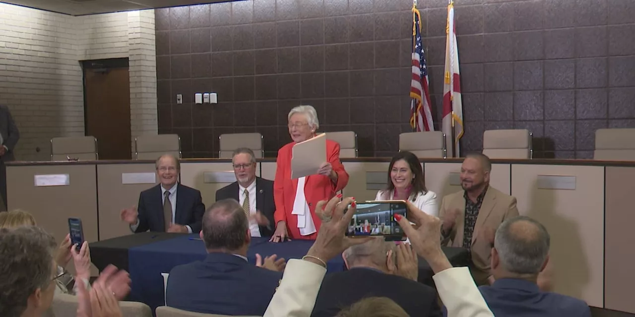 Governor Kay Ivey officially signs the paperwork to eliminate the toll at the Foley Beach Express