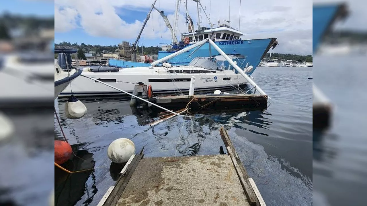 Fishing boat rams pier, several boats near Seattle’s Ballard Bridge