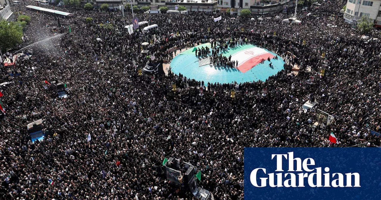 Tens of thousands fill streets of Tehran for Iranian president’s funeral