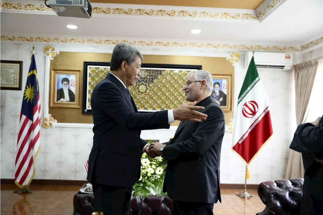 Malaysia's Foreign Minister signs condolence book at Iranian embassy on behalf of govt