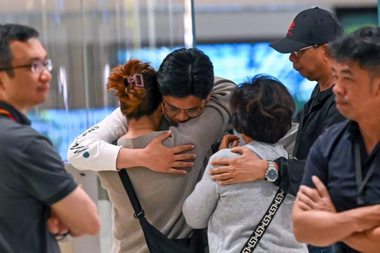 Travelers in turbulent flight land in Singapore