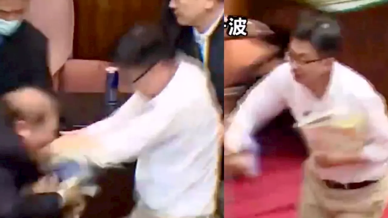 Taiwanese politician runs away with bill to stop it from being passed during parliament