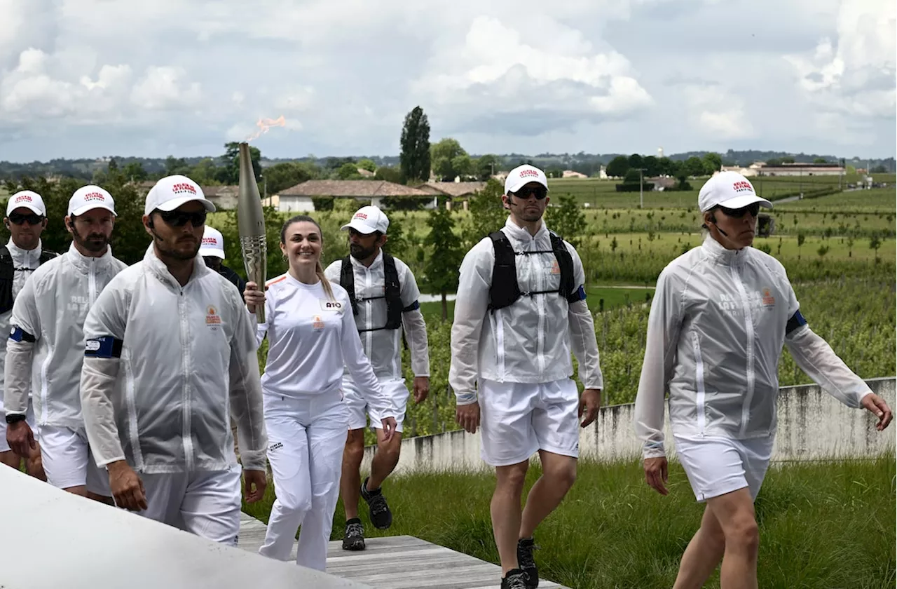 Man is held in France over posts about California murders as Olympic torch passes through Bordeaux