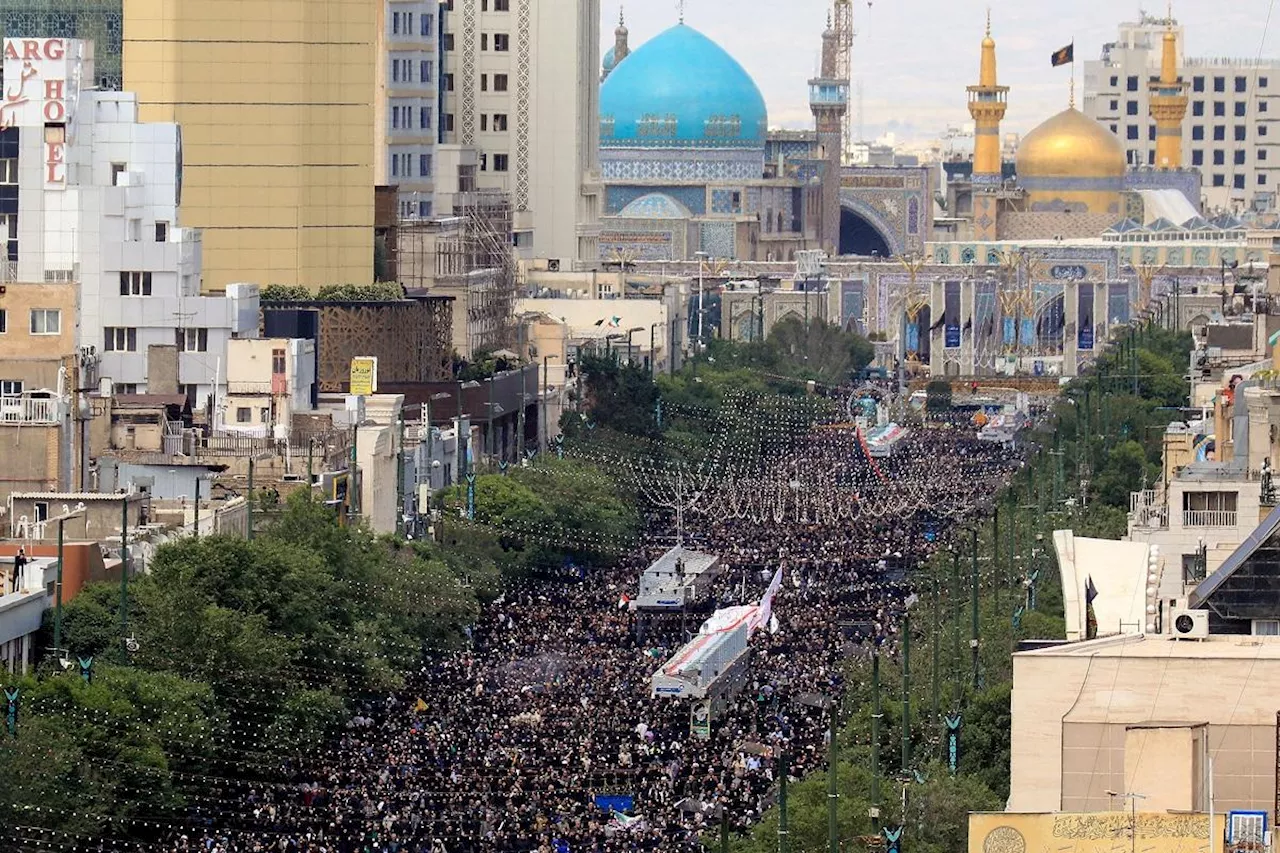 Iran’s Raisi buried in Mashhad as mourners pack Iranian holy city