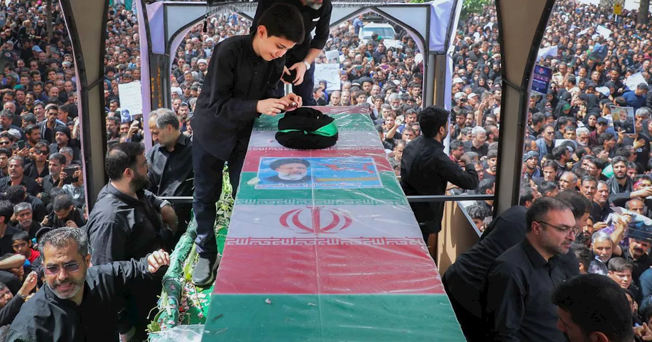 Iran buries president Ebrahim Raisi and others killed in helicopter crash at holy shrine