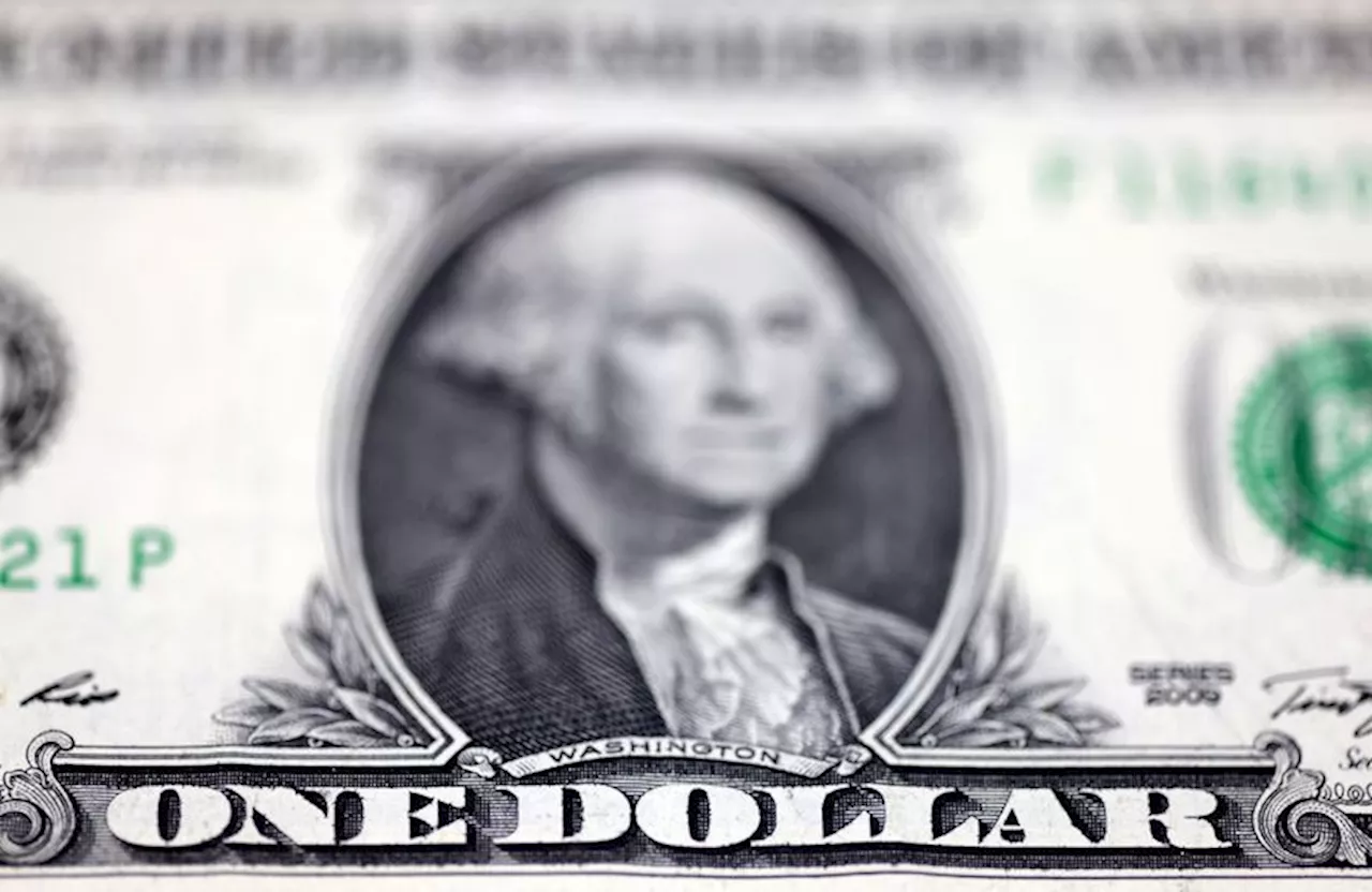 Dollar hovers near highest in a week after hawkish Fed minutes