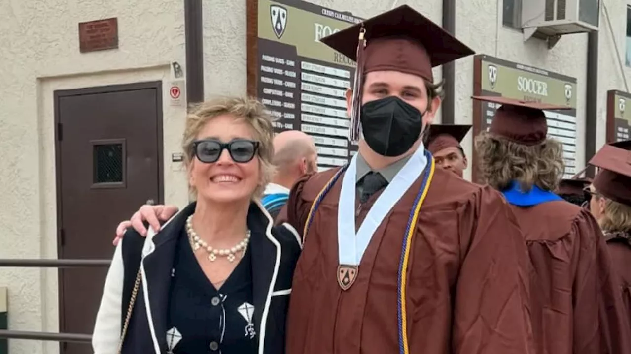 Sharon Stone, 66, looks every bit the proud mom as she poses with son Laird Vonne at his high school...