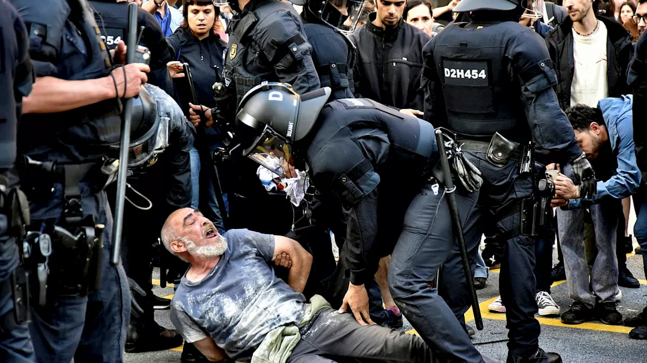 Louis Vuitton fashion show turns ugly: Protesters clash with police after Barcelona park was closed...