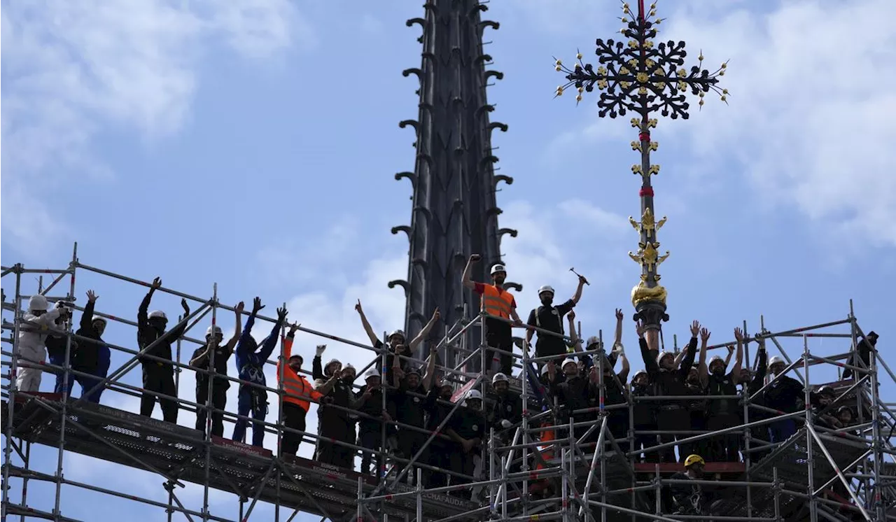 Notre Dame cathedral cross reinstalled in Paris amid restoration efforts