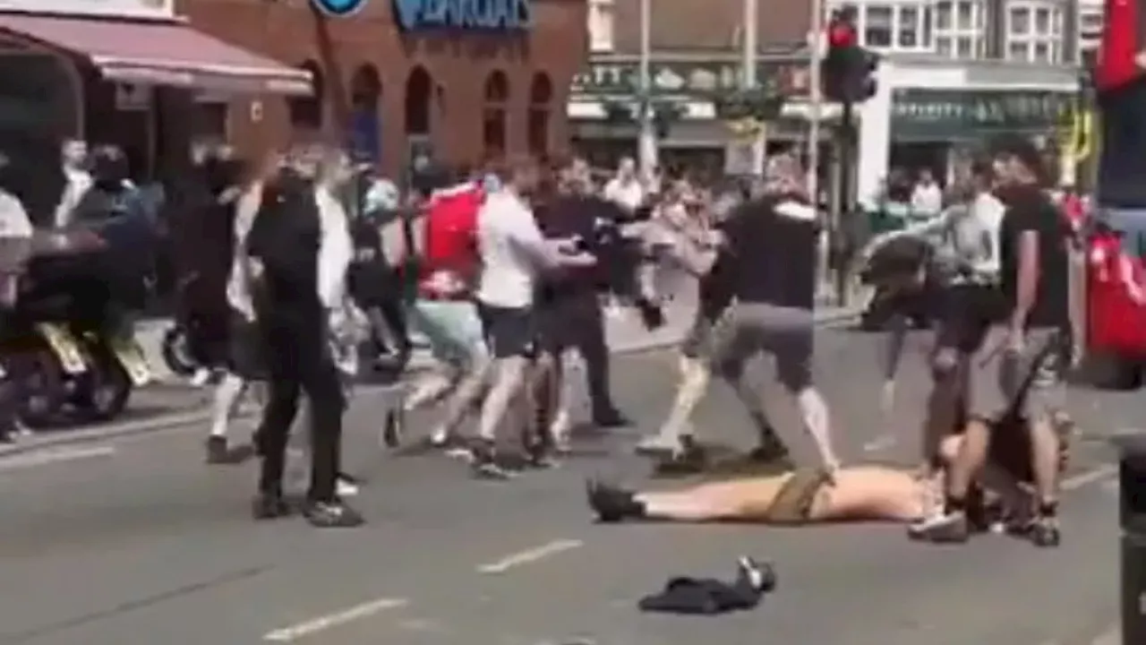 Shocking moment Man Utd and City fans brawl in the street before FA Cup final