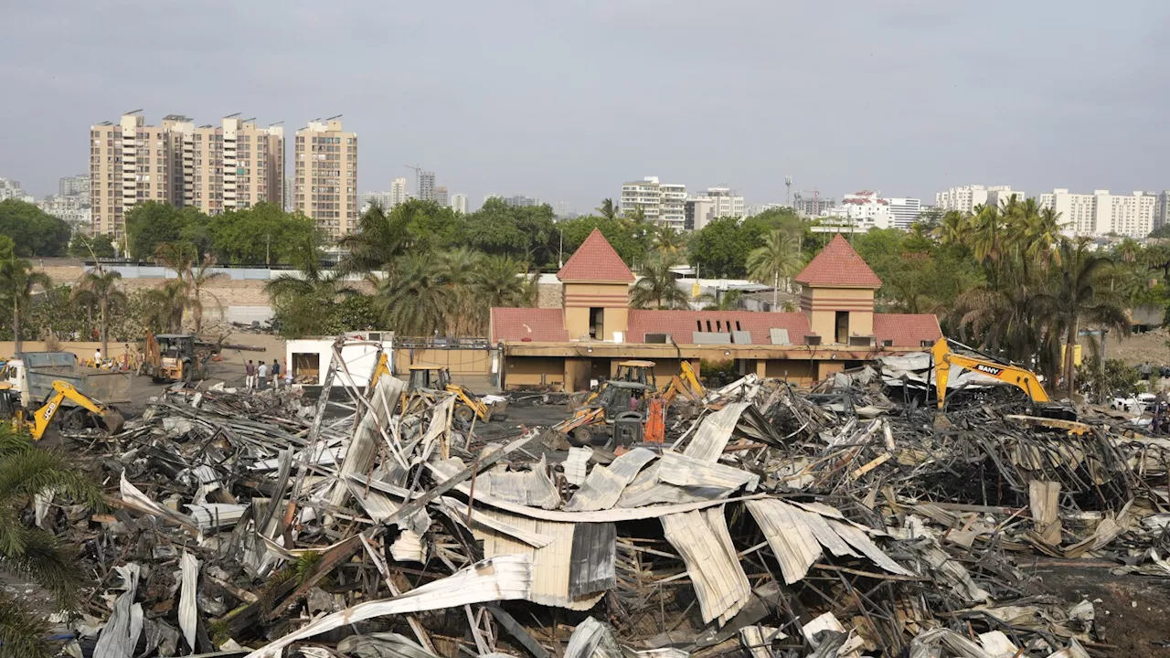 Bodies of 27 'burnt beyond recognition' after a massive fire in Indian amusement park, relatives say