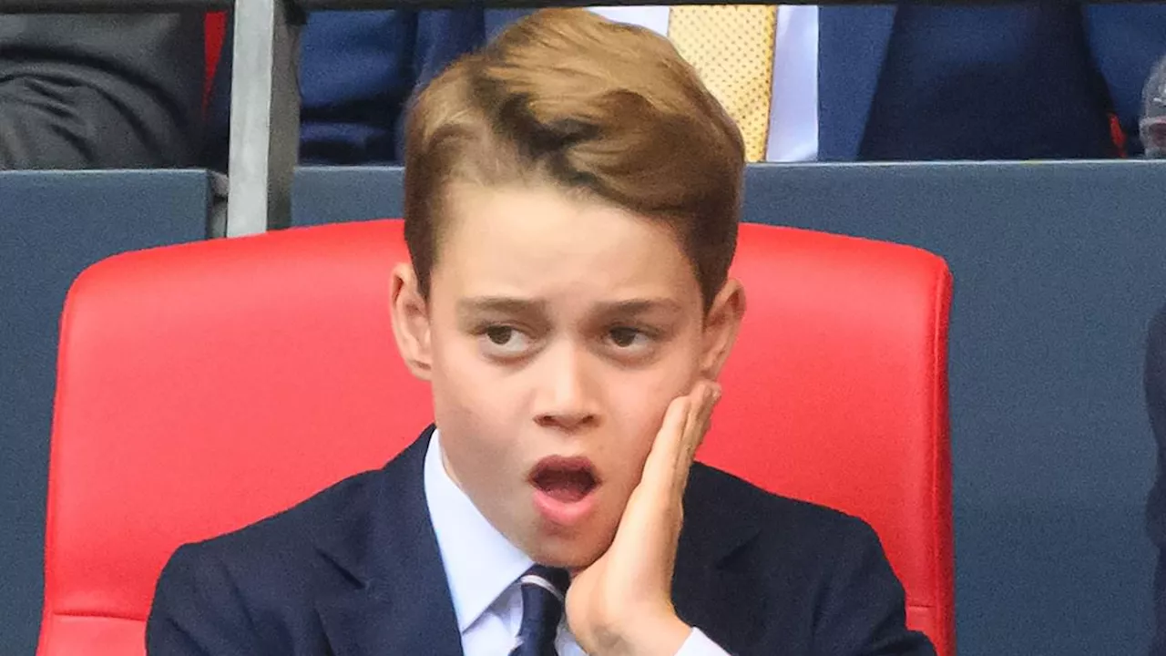 Not a Man United fan then, George? Prince, 10, yawns and looks glum as he joins dad William at...