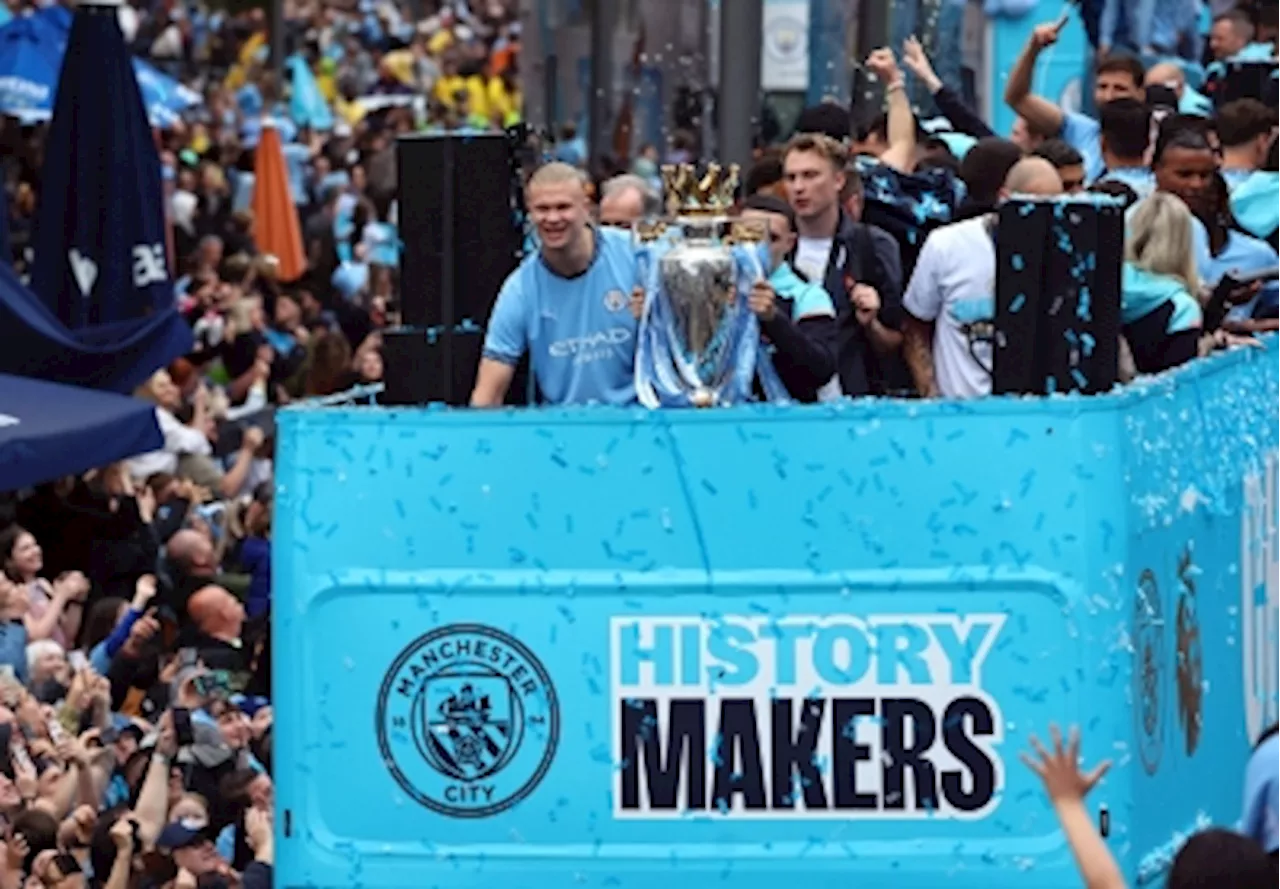 Champions Manchester City celebrate fourth successive title in blue parade