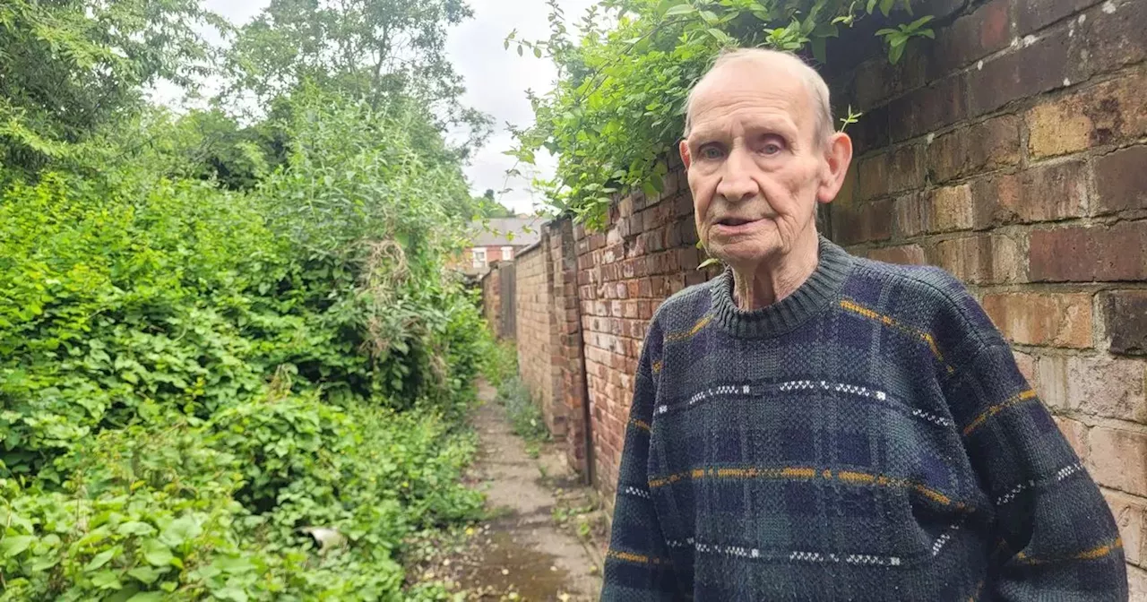 Pensioner laments 'complete disgrace' overgrowth blocking bins