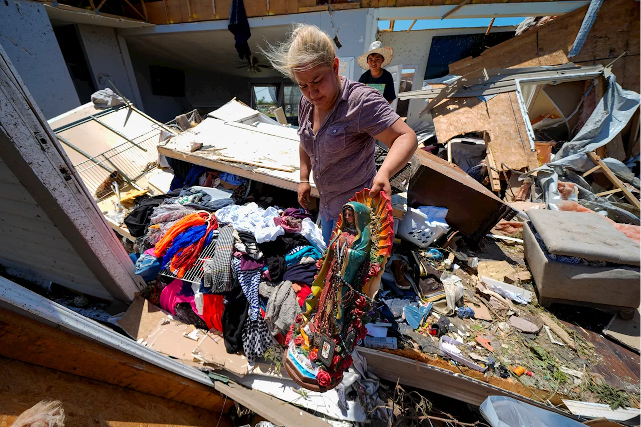 In a north Texas county, dazed residents sift through homes mangled by a tornado