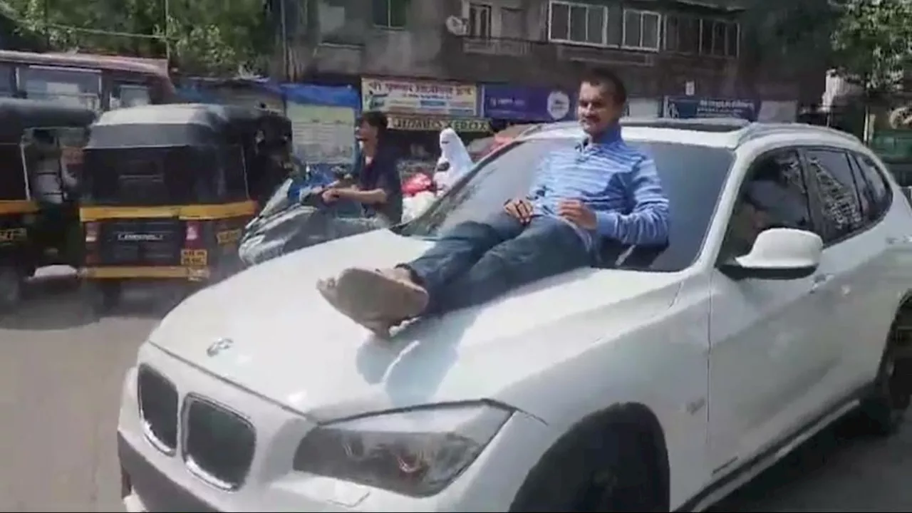 नाबालिग चला रहा था BMW, बोनट पर बैठा था युवक... Video देख पुलिस ने लिया एक्शन