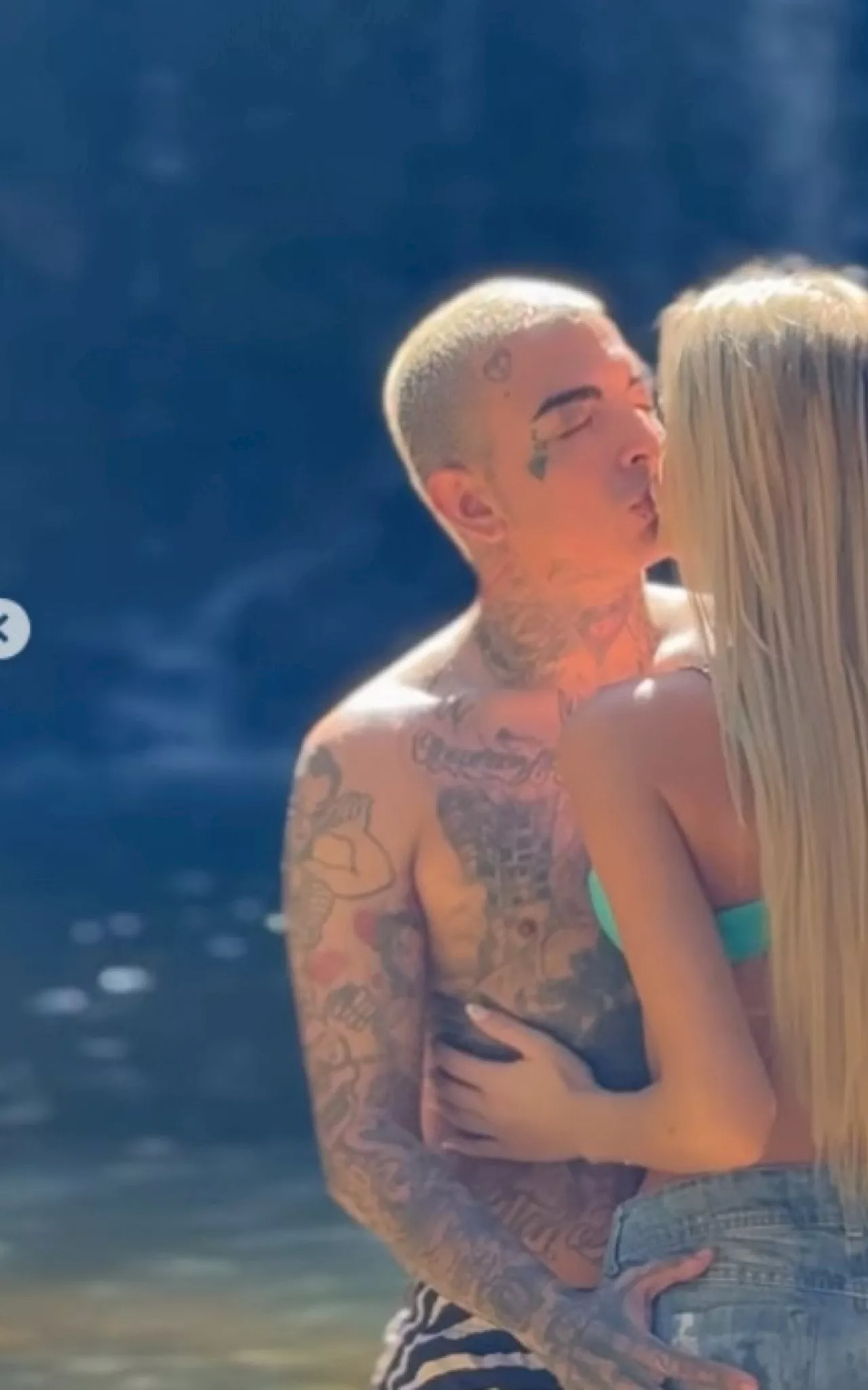 MC Guimê troca beijos com Fernanda Stroschein em cachoeira