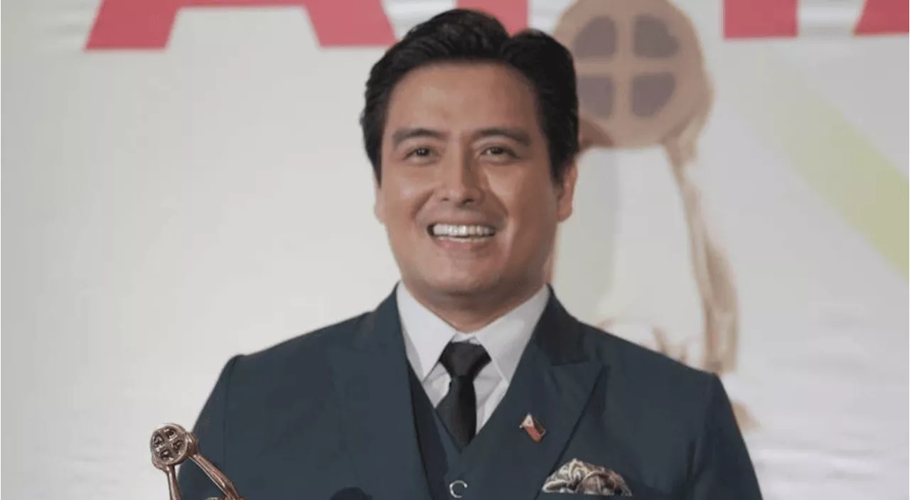 Alfred Vargas falls asleep in bed hugging the Famas best actor trophy