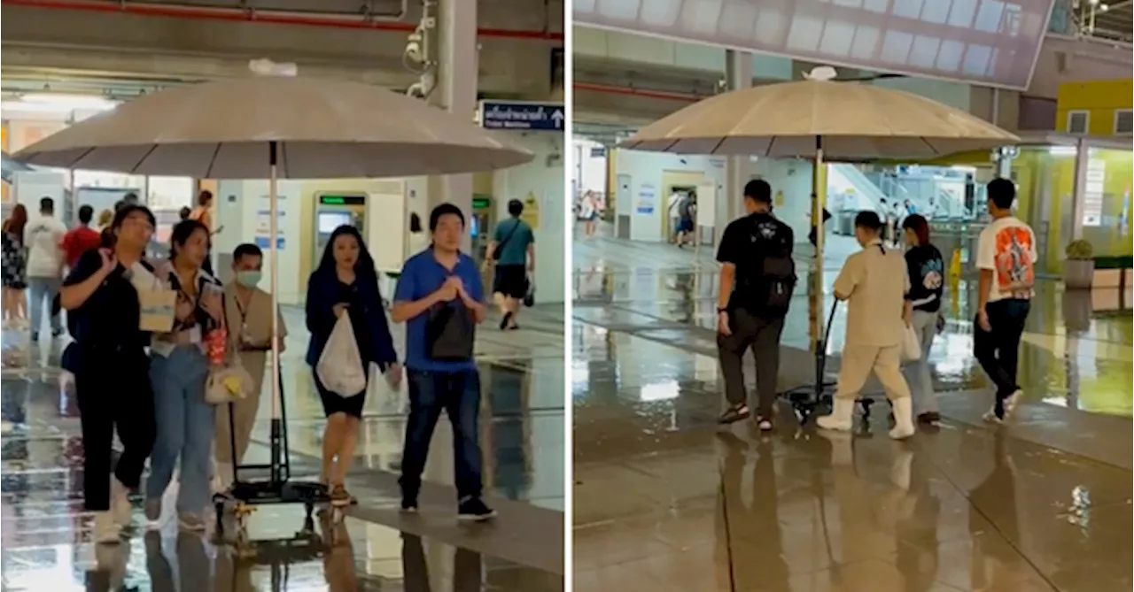 Mall Offers Customers Walking Umbrella Shuttle Service To & From Train Station In Thailand