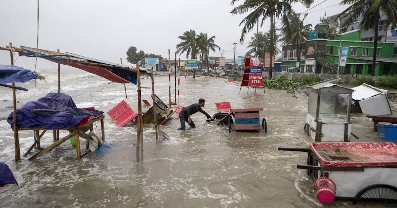 Cyclone floods coastal villages and cuts power in Bangladesh, where 800,000 had evacuated